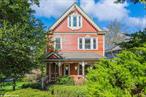 Welcome to this charming Victorian nestled on a picturesque 1/3-acre lot. The 3-bedroom, 2-bathroom house welcomes you with a classic front porchâ€”complete with a swing, perfect for morning coffee or evening chats. Inside, youâ€™ll find a foyer featuring a built-in mirror adding character. The living room features a warm, inviting wood-burning fireplace and opens to a formal dining room, separated by classic double doors. Original detailing is preserved throughout, including oak and mahogany floors. The eat-in kitchen features stainless steel appliances and gives access to a cozy back porch. The walk-up attic is a large and versatile spaceâ€”perfect for a home office or playroom. Downstairs maintains a full basement with two separate entrances provides plenty of extra room and storage. Outside is a private oasis with a beautiful yard ready for gardening, entertaining, or simply enjoying nature. The in-ground pool is safely fenced and perfect for summertime fun. Paver off street parking. This house is full of character and truly a must-see! Come paint your own story on the beautiful canvas of this one-of-a-kind property. 1 Year Home Protection Plan for Buyer included with sale! Call today to schedule a private tour!