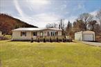Newly renovated Ranch in the town of Livingston Manor, NY. This 1, 431 sf., 3-bedroom, 2-bath home is on 1.08 acres and perfectly situated on a dead-end road, offering peace and privacy. The property features a privacy fence, garage, shed, and a spacious wrap-around deck, ideal for outdoor relaxation or entertaining. Inside, the master bedroom boasts a walk-in closet and an en-suite bathroom for added comfort. The galley kitchen, complete with new appliances, flows seamlessly into a separate dining area, perfect for family meals or hosting guests. The living room is a cozy haven with a pellet stove and bay windows that flood the space with natural light. Throughout the home, you&rsquo;ll find new floors and a bright, inviting atmosphere. A dedicated laundry room with washer and dryer hookups adds convenience to your daily routine. This home is just a short distance from shopping, restaurants, and all the amenities Livingston Manor has to offer. Livingston Manor is a vibrant community nestled in the Catskills, known for its natural beauty and outdoor adventures. Explore the Livingston Manor Covered Bridge for a touch of history, or visit the Catskill Fly Fishing Center & Museum to learn about the area&rsquo;s rich heritage in fly fishing. The town also boasts local art galleries, breweries, and scenic hiking trails, making it a perfect blend of relaxation and recreation.