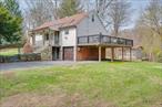 Perhaps the best buy in the Chappaqua School District! This expanded Cape Cod ringed by mature trees has been well-maintained and updated as a multi-generation family hub for almost 60 years. Now it&rsquo;s ready to start that nurturing cycle again with a new family on nearly 2/3 of an acre with water views and lake access on Tara Lake, but no HOA fees or restrictions. The private beach area is open to a limited number of properties around the lake. The home&rsquo;s renovated kitchen has stone counters, an island, a full suite of appliances, and propane for cooking. There are two bedrooms (originally three) and a full, renovated bathroom on the first floor. Two more bedrooms, a full bath, and yet-to-be-finished space on the second floor wait for updates of your choice. Other improvements include: a young roof (approx. 10 years), approx. 700sf maintenance-free deck (2022), above-ground oil tank (2015), and upgraded electrical (2013); permits for all improvements are closed. Municipal water, an expanded septic system, an oil-fired furnace, and hot-water baseboard and steam heat support this comfortable home. The location on a primary, county road means reliable plowing when snow falls. Chappaqua schools, local shopping and services, easy access to highways, public parks and recreation; and multiple MetroNorth options are the perfect suburban mix. All inclusive taxes for 2024 = $15, 241; current STAR = $1, 702 standard/$3, 676 enhanced. Grab this rare opportunity to buy a move-in ready home in one of Westchester&rsquo;s top-rated school districts for an as-is price with lots of potential to add value.