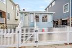 Come see this Adorable, Renovated Ranch in the West End of Long Beach.This House features an Open layout of Living Room/Dining Room area going into a Beautiful Kitchen. 3 Bedrooms, 1 Full Bathroom, Laundry Room with a Tankless Heating system, Washer/Dryer, Electrical Box. Steps going down to a large Full-Unfinished Basement (7 feet high ceilings). House has been renovated 12 years ago. House has fencing around the house. Close to Everything! Flood Insurance $3, 313.68 a yearBeing sold in AS IS Condition
