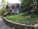 Escape to scenic Cornwall, one of the Hudson Valley&rsquo;s most desirable towns just over an hour from NYC! Enjoy beautiful views from the deck inviting you to savor slow mornings and starlit evenings. Home has been beautifully preserved and is move-in ready, open floor plan features sun-filled rooms. Knotty pine woodwork in third bedroom adds timeless warmth and appeal. Artful stone craftsmanship is evident thru-out the home and property. Cozy up by the beautiful stone Fireplace featuring a Jotul wood-burning stove. Perfect for gardeners with ample space to create your dream gardens or enjoy outdoor recreation. Auto enthusiasts will appreciate the rare 5-car garage with compressor, electric and ample workspace. Close to hiking trails, parks, great dining, the world renowned Storm King Art Center, West Point and the Hudson River. This property offers the perfect mix of tranquility and accessibility and true Hudson Valley charm!