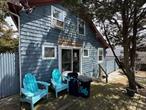 Charming old-fashioned summer cottage with wood-burning fireplace, bright sunny decks, outdoor shower. Large open living/dinning room with two bedrooms on the main floor and two additional bedrooms & bath on the second level. Located close to all the activities in Cherry Grove and most importantly, just steps to the beach!