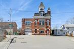 A Once-in-a-Lifetime Opportunity: Own a Historic Victorian Firehouse in the Heart of BeaconPresenting a truly exceptional offering: a one-of-a-kind, second empire, Victorian firehouse nestled in the vibrant heart of Beacon, just steps from the lively restaurants and activity of the east end of Main Street. Built in 1889, this stunning brick architectural landmark is rich in original detail and character, a testament to Beacon&rsquo;s storied past.Rising two and a half stories on the street side, the firehouse is distinguished by its striking mansard roof, original bell tower (adapted for a siren), and a second tower, once essential for drying hoses. The facade is a masterpiece of fine brickwork, adorned with a bracketed and dentillated cornice and the original, proudly displayed â€œBeaconâ€ lettering.The street-level first story features a meeting room, offices, and a lavatory, alongside an apparatus bay added in 1924 on the east side. Ascend to the second story and discover a dramatic and grand gathering room illuminated by beautiful arched windows. The room&rsquo;s focal point is an original plaster medallion on the ceiling, uniquely designed with a firehouse motif. Southern yellow heart pine vertical grain wood floors are ready to be refinished under the tile floor. The east side of this level offers picturesque views of Mount Beacon and includes a spacious, mess hall-style kitchen, once the hub for community events.The third half-story reveals the building&rsquo;s robust interior construction with original, massive wood beams, previously utilized for storage. From here, access the roof and be rewarded with breathtaking panoramic vistas: the majestic Mount Beacon to the east, and the charming rooftops and Fishkill Creek to the south.Below the first story lies an unexpected and inviting clubhouse area. This space boasts a handsome oak bar, a brick and stone mechanical room which could also make an amazing wine cellar, and a pool table game room. Step outside to a surprisingly large deck, enveloped by trees, offering a magical and private setting for gatherings and entertaining.Keep warm with heat provided by a gas fired Hydrotherm boiler. The building has a 40 gallon American Standard hot water heater, 200 amp electrical service, back up generator, and central AC in the basement.Zoned R1 single family, this remarkable property also benefits from its location within the Historical Overlay District and its prestigious listing on the National Historic Registry. This unique combination unlocks an exciting array of adaptive reuse possibilities. Permitted uses include single-family residency, or with a special use permit: a boutique hotel with accessory services, a distinguished social club, a restaurant accommodating up to 50 seats, professional offices for up to 10 employees, multi-unit dwellings (up to 4), an inspiring art studio, and more. (See attached document for a complete list of potential uses.) Additionally, the City of Beacon maintains a camera on the roof, which will remain in use.Please see attachments for more information.Don&rsquo;t miss this extraordinary chance to own a significant piece of Beacon&rsquo;s heritage and reimagine its future.