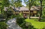 Nestled in the heart of the picturesque Hudson Valley, this stunning Tudor-style mansion is a true dream estate. Boasting an impressive 9, 481 sq ft of living space, this magnificent property is situated on 50 acres of meticulously landscaped gardens, making it one of the most sought-after locations in the county.The estate features a 3-acre lake with a charming boathouse, a sparkling pool, a tennis court, a serene Japanese garden, and a guest house for visitors. The sprawling grounds also include rolling lawns, a quaint orchard, and vegetable and berry gardens, creating a botanical paradise that is sure to impress even the most discerning buyer.Steeped in history, the property features a cobbled drive lined with stones salvaged from old Bronx streets, adding to its unique charm. The interior of the home is equally impressive, with a breathtaking great room featuring a cozy fireplace, 40-foot vaulted oak-beamed ceilings, and towering glass doors that open up to the picturesque lakeside.With 11 bedrooms, including a recently renovated primary bedroom suite with an expansive bathroom, office, and den, as well as a stately oak library and multiple dining areas, this estate is perfect for entertaining guests in grand style. Whether used as a summer retreat or a primary residence, this property offers the perfect blend of luxury and comfort.Conveniently located with easy access to highways and Manhattan, this estate truly offers the best of both worlds. Don&rsquo;t miss your chance to own a piece of Hudson Valley history and make this extraordinary property your own.