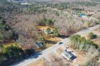 This a Golden opportunity in a prime and sought-after location with two homes on 26+ acres in the heart of the Sullivan County Catskills. Location and land are perfect for a family compound, hobby farm, agri-business, artist/ yoga studio, live/ work situation, Airbnb/ rental income, and more. Main home is as charming as you can get with warm woodwork, elegant touches, and a fully functional interior. It is currently used for retail (antique shop) and offers a country eat-in kitchen, large living/ dining room, sunroom, 3 BRâ€™s and 1 full bath with additional room and a full walk-up attic offering flex space. A full walk-out basement with utility sink is a bonus for workshop/ extra storage. The cottage is 2 BRâ€™s, a full bath and an open concept (currently rented). Main house is approximately 2000 SF on main level, not including attic which is heated, cottage is 904 SF. Two outbuildings include a handy man barn as well as a new barn, which is 18x24, and well-built, insulated and heated - a great plus for your hobby needs and the perfect addition for studio/ storage. Some of the land around the homes is open and the rest is level and wooded with deciduous and evergreen trees and slopes down toward the back to small frontage on Ballard Road. Perfect for horses, farm animals, additional developmentâ€¦ Situated in the town of Bethel with so many possibilities, let your imagination run wild!