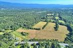START YOUR FARM GRANTS: https://agriculture.ny.gov/farming/start-your-farm  FUNDING OPPORTUNITIES: https://agriculture.ny.gov/funding-opportunities   RA Zoned Business opportunity with 98.7 acres of fields, forest, trails, views, and a pond on two separate lots. Bordered by 1, 932 feet of road frontage on 17k and the backdrop of the Shawangunk Mountains this location is ideal for transportation of goods utilizing Stewart International Airport nearby, and the fleet of a major trucking company. This property is also centrally located to bridges and interstates and in a growing area of development and public attractions such as LEGOLAND in Orange County NY, Resorts World Casino in nearby Sullivan. The profit potential by cultivating fields of hemp or any product is enhanced by the ability to also sell the product at the location by renovating the oversized rustic barn into a warehouse and showroom and utilizing the current 3 bed, 2 bath single family home into living quarters for employees of the farm. Orange County welcomes all Agri business and there are many officials who would like to see this area thrive. While hemp is a highly profitable commodity, other applications may be more suitable to the discriminating buyer. Rustic Wedding Farm to Table venues would be another ideal setting for this property, especially with a backdrop of the mountain views and the existing barn just waiting for a rustic renovation as a reception area. A vineyard, distillery or other such type of product would be a welcomed addition to a wedding venue and can be utilized separate from the event for an additional stream of revenue. What would be a highlight is if the town would permit the forested area to be converted into small lodging units such as smaller homes or upscale cabins for guests of the wedding and to be used for weekend getaways with a special theme location. The owner had previously been solicited by new solar farming startups as the location has a southern exposure and direct connection to major utility lines on route 17k, for power transfer. Serious offers will now be considered. There are two adjoining parcels with the sale zoned RA. One is described as 450 Rt 17K and the other parcel 0 Petticoat Lane, both in Bloomingburg and Orange County NY. SBL#&rsquo;s 1-1-7.210 and 22-1-47<r Residential development opportunity could be approved and is permitted by zoning.