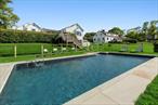 Welcome to 100 S Fairview Ave, Montauk, New York, a spacious 3-bedroom, 3-bathroom haven nestled just off the 10th hole of the scenic Montauk Downs Golf course. This property boasts an expansive .87 acre lot, adjacent to an equally large reserve, ensuring a tranquil setting with just one neighboring property.Step inside to almost 2, 500 sq ft of living space, bathed in light from large windows that frame 180-degree panoramic views of the golf course and stunning sunsets. The heart of the home, a large kitchen equipped with a JennAir range and Miele dishwasher, invites everyone to gather and create memories. The living room, featuring a stone fireplace, provides a cozy spot for relaxation, while the sun-filled family room offers ample space for entertainment and leisure.The primary bedroom comes complete with a full bath, offering a private retreat within the home. The lower level, partly finished and with a walkout, provides additional space for customization according to your needs.Outside, a new pool installed in 2019, complete with new equipment and a dedicated gas tank, invites you to enjoy refreshing swims and sun-soaked relaxation. The property also features a new septic system, central A/C, and an irrigation system to maintain the lush landscape.A detached 2-car garage offers plenty of storage and parking space, and comes with an attached 70 sq ft shed for additional storage. The property is further enhanced with new decking, perfect for outdoor dining and entertaining.Located close to town, you will find convenience and community at your doorstep. The nearby Ditch Plains and Harbor area offer a variety of recreational opportunities, including water sports, fishing, and dining at local eateries.Experience the perfect blend of privacy and community at 100 S Fairview Ave, your new home in Montauk, New York.