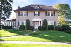 The Grand Dame of Ellison. A true gem, long admired for its unmatched curb appeal in all of the Cedar Knolls vicinity! This stunning home showcases magnificent gardens with mature plantings and a large flat backyard-perfect for outdoor entertaining, play or peaceful relaxation. Brimming with natural light, the entire home offers an exceptionally bright and cheerful atmosphere. Inside, the main level features a welcoming entryway, a charming eat-in kitchen with a bay window and direct access to the backyard patio, a formal dining room ideal for hosting guests, and a spacious formal living room with wood-burning fireplace. Two sets of French doors lead seamlessly into the beautiful, three-windowed sunroom- a serene haven for reading and relaxation. Also on the first floor is a versatile office or den with built-ins, offering a comfortable and productive work-from-home environment, along with a convenient powder room. The second floor boasts a well appointed primary bedroom with an ensuite bath, three additional spacious hall bedrooms and a full hall bath. Each bedroom benefits from multiple exposures, filling the spaces with natural light. The third floor offers a bonus room currently being used as a bedroom, plus a full bath-ideal for guests, an au pair or additional living space. Although the home predates the Certificate of Occupancy (built in 1920), it appears that the third floor has been grandfathered in. The generously sized lower level includes a working wet bar, laundry room and a cedar closet and ample storage. With a walkout entrance to the backyard, this level is perfect for recreation, storage, or play. This house has been called home to only two families and is now ready for you to call it home...