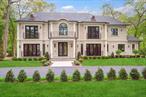 Muttontown  Set on over two private acres on a quiet cul-de-sac, 20 Knollwood Road is an exceptional new construction estate that blends timeless architecture with elevated, modern finishes. With six en-suite bedrooms, soaring 10-foot ceilings on every level, and thoughtfully designed indoor and outdoor spaces, this home is perfectly suited for refined living and grand entertaining.The main level showcases radiant porcelain tile, coffered ceilings, and custom millwork throughout. The kitchen is a true showpiece, featuring two oversized islands with seating and storage, marble countertops, paneled Sub-Zero appliances, a Wolf range and ovens, farmhouse sink, pot filler and more. A formal dining room with wet bar and herringbone floors complements the space, while a powder room finished in striking black marble adds a dramatic touch.The expansive living and entertaining areas flow seamlessly to the outdoors through French doors, opening to a porcelain-tiled patio and a heated Gunite saltwater pool with automatic cover, integrated spa, and lush surroundings. The home includes a full house generator powered by two 1, 000-gallon propane tanks, three-zone HVAC, a space for a future elevator, and smart home wiring for speakers, alarm, and surveillance.Upstairs, the primary suite offers a private balcony, dual walk-in closets, and a spa-quality bath with double vanities and Toto fixtures. A junior suite with a Juliet balcony offers additional luxury, while a second-floor laundry room and central vacuum with hidden hose system provide modern convenience. All bedrooms feature en-suite baths, with elegant grey, white, and black marble finishes carried throughout.Additional highlights include a three-car garage with room for car lifts, a mudroom entry, baseboard outlets, flush floor vents, and a 300-pound chandelier motor lift. The home is clad in limestone stucco and brick, with black iron doors and Pella windows offering a sleek, modern exterior. The unfinished lower level leaves over 3, 000 sq.ft. to the imagination - with full bathroom and second laundry room to cater to the pool. A rare offering in Muttontownâ€”luxury, privacy, and craftsmanship converge at 20 Knollwood Road.