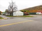 Introducing a prime commercial property, a free-standing 14, 200 square feet, clear span, insulated warehouse building all available for sale or lease.The building is in an excellent condition on a beautiful view property.Ideal for many type of uses including light manufacturing, packaging, distribution, storage, medical, gymnastic or sports facility and more.&#160;Building is supported by like-kind infrastructure including heavy electric power, natural gas, public sewer & water, well-configured office space and bathrooms.BUILDING FEATURES:â€¢ Available Space: 14, 200 sq. ft.â€¢ Ceiling Heights: 16â€™ clearâ€¢ Clear spanâ€¢ Office Space: 2, 600 sq. ft. on 2nd level with seprate entrance.â€¢ Loading: Four (4) 8&rsquo;x9&rsquo; loading docksâ€¢ Utilities: Municipal water and sewer. Gas & Electric.