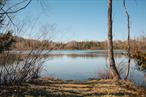 This parcel, spanning 159 acres, is primarily mature woodlands and a large pond. The parcel features its own entrance at 2044 Route 9G, and boasts a crystal-clear water feature, with fish and wildlife, offering a tranquil and scenic focal point. This land also includes its own set of trails weaving throughout the property. The eastern border of the property leads to a 150+ acre Winnakee Land Trust parcel ensuring protection from further development. Abundant natural beauty, just minutes from Hudson Valley attractions yet a world away in terms of peace and privacy.