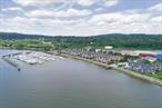 At the widest part of the Hudson River with the most gorgeous sunsets ever only 35 miles from NYC, enjoy the majestic Hudson from your 35 ft BOAT SLIP at Half Moon Bay Marina, nestled between Croton Point Park and Senasqua Park, near the Croton Sailing School. Amenities include floating docks with deep water slips, 100 foot breakwater wall, fresh water, 24 hour marina security, lighted parking lot, showers, restrooms, internet hookup, cable TV, 110/220 volt dockside power. Marina slip fees billed quarterly. Enjoy the Riverwalk, bike and hike the area, walk to the Village shops, restaurants, pubs, train. A magical location where you feel like you are on a vacation every day. This slip is in a most desirable location within the marina and fits up to a 38 foot boat. Boaters&rsquo; Choice Award winner!