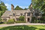 Set majestically on a stunning acre of landscaped property overlooking Siwanoy Golf Course, this strikingly handsome Lewis Bowman Tudor is the epitome of elegance and grandeur. This beautiful stone facade home can be lived in so many ways. If your preference is for smaller living space, the layout allows for extra rooms to be used as auxiliary spaces for gyms, play areas, etc. The public rooms are substantial statement rooms. Inside, the oversized receiving hall features its own wood burning fireplace, beamed ceiling and period pegged wood floors. The dramatically spacious sunken living room with fireplace features original floor to ceiling leaded windows. Adjoining the living room, a lovely enclosed porch with slate floor overlooks specimen landscaping. A sun filled den offers access to a private stone terrace with period stone walls. Beyond the large formal dining room, there is a generous kitchen with granite countertops and a marble island. A private office/staff room with full bath completes the 1st floor. Up the grand staircase, the large primary suite features a spacious dressing room and oversized bath with gold leaf vintage tile. Two additional large ensuite bedrooms are complemented by an inviting library with fireplace and custom built ins. Two more bedrooms and a bath are accessed from a back hall/staircase. The third floor features 3 large rooms and a full bath. All this plus a vintage lower level play room with fireplace and wet bar, an attached 3 car garage and a charming stone potting shed. A rare opportunity to own a treasured Bowman home! Additional Information: HeatingFuel:Oil Above Ground, ParkingFeatures:3 Car Attached,