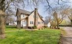 Live / Work for Under $750, 000. Beautifully built, this grand and graceful circa-1935 home features lasting quality craftsmanship, lots of light, beaming hardwood floors, classic built-in cabinetry, and a wood-burning fireplace. Sited on .35 acres, the two-story, 2, 250-square-foot home / office comes with four bedrooms, two baths, a two-car garage with extended drive, &#160; and the timeless appeal of a Garden City-style home without the premium price tag.