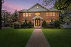 Welcome to this stately brick center hall Colonial nestled in East Williston. Custom built in 2007, this 4-bedroom, 4.5-bath home offers timeless curb appeal and elegant design. Enter inside a soaring two-story foyer that sets the tone for luxury throughout. The main level features a spacious formal living and dining area, a skylit chefâ€™s kitchen with commercial-grade appliances, and a first-floor primary suite for added convenience. Upstairs, a second primary suite adds flexibility. Custom doors, windows, and detailed finishes enhance every room. The fully finished walkout basement provides additional living space, ideal for entertaining or relaxing. Enjoy the large fenced backyard with a paver patio perfect for outdoor gatherings. Central air, central vacuum, and other quality systems offer modern ease. Located in the East Williston School District near shopping, parks, dining, and the LIRRâ€”this is refined suburban living at its best.