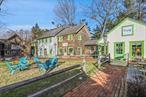 This retail complex offers a serene environment creating a natural sanctuary for health and wellness. The thoughtfully designed spaces flow harmoniously around the verdant center, offering a tranquil setting where businesses can thrive. With antique charm and a small village feel itâ€™s comprised of three buildings that are divided into multiple spaces with a beautiful grass square at the heart of the complex. A very successful health juice company was founded at this very tranquil wellness village. The centerpiece, a two-story barn-style building, features a quaint cafe; with flagstone floors, antique beams, and a sun filled seating area. It&rsquo;s complemented by a versatile retail shop, wellness center, commissary, and airy studio spaces with cathedral ceilings. The complex also houses a cozy two-story retail/office building. Completing the trio, a majestic barn and attached schoolhouse structure present spacious, sunlit areas and a shared bath, encapsulating rustic elegance. At the heart, a verdant square invites relaxation. Ample parking ensures visitor ease. This complex is more than a location; it&rsquo;s a destination where history and convenience converge.