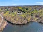 Prestigious 8- Acre Estate Site with Sweeping Lake Views & Equestrian Potential.An exceptional offering for the discerning buyer: 8 acres of level, beautifully usable land in one of the region&rsquo;s most coveted and prestigious enclaves. Set amidst a backdrop of mature trees and open skies, this magnificent property boasts commanding lake views, absolute privacy, and the rare luxury of space to create a truly world-class estate.Design your dream home, complete with elegant gardens, a private pool, tennis court, or even a full equestrian facility, this is a canvas with limitless potential. The setting invites a lifestyle of refined tranquility, yet remains just minutes from fine dining, elite schools, and all the conveniences of town. The septic is for 7 legal bedrooms.Whether for a private retreat or a generational legacy, this is a property of unmatched beauty and opportunity.Bring your architect, your vision, and your horses. This is a luxury without compromise!