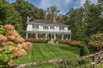 Stylishly reimagined by two New York fashion VIPs, this sophisticated 1905 Colonial blends modern luxury with the homeâ€™s original integrity, grandeur and charm. Tucked away on Hardscrabble Road, the serene sanctuary---a highlight of the New Castle Historical Society house tourâ€”offers a Martha Baker-designed landscape, close to an acre, comprising woodlands, curated boxwoods, flowering dogwoods and a rose-trimmed garden fence. A rustic pergola leads to a freeform Gunite pool, while an original stone chapelâ€”now a meditation space or poolside cabana-- has been rebuilt with a new cedar roof. The updated 4-bedroom home features custom millwork, wainscoting, and three wood-burning fireplaces. Interiors by Foley & Cox and designer Libby Cameron, offer refined comfort and timeless elegance. The kitchen centers around a hand-mitered Carrara marble island, with top-tier appliances and bespoke fittings. Radiant-heated, hand-hewn walnut floors extend through the kitchen, family room and first-floor ensuite bedroom. Upstairs, the primary suite includes a carved fireplace mantel, custom closets and French doors to a private balcony. A skylit, mid-century-inspired third floor serves as a spacious luxe home office. Located in the coveted Chappaqua school district, itâ€™s minutes to the Saw Mill Parkway and Chappaqua Metro-North.