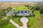 Located on a quiet cul-de-sac, this magnificent waterfront estate includes a 10, 000 sf Colonial style house on 2.62 acres in Back Lawrence looking southeast over Reynolds Channel. It offers a unique opportunity to secure a private waterfront estate with amazing views close to NYC, JFK and the Atlantic beaches. The three story Colonial style residence is surrounded by beautifully landscaped grounds with an in-ground pool, koi pond and tennis court. There is an attached three car garage with a 1BR apartment above and a full unfinished basement.