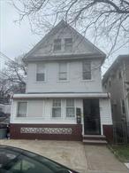 Detached converted multifamily in Rosedale, features two bedrooms, eat in kitchen, full bath on each floor with full finished basement.
