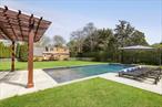 A canvas for creating memories, laughter, and a legacy. Moments from iconic beaches, Michelin-star dining, and designer boutiques, yet tucked away for serenity, this home invites you to imagine lazy mornings, garden parties, and timeless gatherings under the stars. This recently refreshed home is a unique opportunity to live in one of the most desirable locations, in Bridgehampton, south of the highway. It is move-in-ready, with three bedrooms, a sizable pool house, pergola, 40 x 20 gunite pool with sun-deck and spa. On 0.58 acres, the mature trees and hedges surround the property. Make your 2025 summer season an enjoyable outdoor experience. The property also has health department approval with architectural drawings to build a brand new 4, 800 sq ft home with a finished lower level. Properties like this with location, privacy, and flexibility rarely come to market.