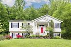 Welcome to 43 Hickory Road, located in the picturesque village of Sloatsburg, N.Y. This spacious raised ranch home offers 4 bedrooms(possible 5th) and 3 full bathrooms, providing plenty of room for comfortable living. Enter light and airy main floor with hardwood floors, to left is the large Primary bedroom with spacious bath and walk in closet en suite, full hall bath and 2 more bedrooms. The open plan offers a great room with gas fire place, cathedral ceilings, and French Doors opening to a screened in porch that opens out to pool deck area. Great room flows into large open eat in kitchen with center island and the formal dining room. The lower levelfeatures a second family room, bedroom with a large closet, full bathroom, storage closet, office with an oversized walk-in closet (which couldeasily be used as a 5th bedroom), oversized laundry room, 2 car garage with a freezer and a bonus storage room. The outdoor space offers an above ground decked in heated pool in a peaceful setting, perfect for relaxing or entertaining. Less than a quarter mile to Pine Grove Lake and it&rsquo;s amenities and activities open to residents with their $550/year HOA fee. Harriman State Park with it&rsquo;s amazing hiking is just down the road as is the NJ Transit train to NYC. Shopping, dining, and major roadways all nearby. This property combines comfort and convenience in a beautiful setting. Donâ€™t miss the opportunity to make this wonderful house your next home!