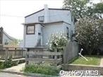 **ALL CASH OFFER ONLY** 1200 Sf Home-Park Your Boat On Driveway. Best Priced Waterfront Colonial Across From Bay County Park, Full Bsmt-Eat-In Kitchen-Two Entrances-It Was Used As Mother/Daughter. Buyer Has To Verify All The Information., Additional information: Appearance:Excellent, Separate Hotwater Heater:Y