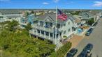 A rare opportunity to own one of Long Beach&rsquo;s most magnificent Oceanfront Homes. Over 63 Feet of private white beachfront off the beautiful Atlantic Ocean. This custom-built FEMA-compliant masterpiece brings functionality, versatility, and luxury together into an open-air concept floor plan. This estate welcomes you with a grand driveway that fits 9 cars, fixed with mahogany garage doors and epoxy flooring. Inside, the great room features cathedral ceilings, a grand staircase, and several glass doors allowing for a stunning panoramic view of the Beach and the Ocean. There is access to a beautiful beachfront deck perfect for entertaining. The inviting open-concept kitchen has custom features throughout, including GE Monogram appliances, dual dishwashers (Boche and Miele), a wine fridge with accompanying appliances, and more. In this 5-Bedroom, 5-Bath beauty, each of the 5 Bedrooms is bright and airy with Ocean Views from their private balcony. The main en-suite features a walk-in closet, an oversized Bathroom, and is complete with access to a top-floor oceanfront Deck. Additional features include sound and security systems, custom tile work, bamboo flooring throughout, DaVinci roof, and custom pavers. Over 2000 feet of outdoor living space. This enclosed paradise includes 2 outdoor showers and over 1000 square feet of IPE decks overlooking the Atlantic Ocean with a bar and TV area on the ground floor. Detached garage (additional 12x20) for storage. This Smart home allows the owners to control all appliances, thermostats, lights, heating, and other devices while also remaining energy efficient. Move right into this fully furnished beachfront beauty.