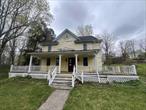 Bring this 1900s Victorian farmhouse with lots of charm back to life.  Brand new roof. Amazing wide board hardwood floors and original moldings in many rooms. Wraparound porch and detached garage.  A quick cycle to the Harlem Valley Bike Trail. Sold as-is. Buyer to pay NYS and any local transfer taxes. Cash offers with proof of funds and rehab loans only **Please see agent remarks for access, showing instructions and offer presentation remarks.**