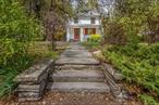Nestled in Woodstock&rsquo;s storied Byrdcliffe district, this charming 1920&rsquo;s home balances original character with modern comforts. A comprehensive renovation has brought thoughtful updates throughout, including a brand-new kitchen and baths, upgraded flooring, enhanced insulation, a new roof and a new heating system. Original stained glass windows serve as artistic focal points, honoring the home&rsquo;s heritage and adding timeless appeal. The main level features a formal dining room that flows effortlessly from the kitchen and living roomâ€”an ideal layout for both everyday living and entertaining. A convenient half bath completes the first floor. Upstairs, you&rsquo;ll find three bedroomsâ€”including one with a walk-in closetâ€”along with a full bath. An attic offers additional flexible space, ideal for a studio, office, or creative retreat, especially fitting in this art-inspired community. Outdoor living is equally inviting, with a welcoming front porch, a landscaped level yard, an enclosed back porch, and a practical mudroom entry. The detached garage adds versatility for use as a workshop or additional storage space. Located just a stone&rsquo;s throw from Woodstock&rsquo;s vibrant cultural scene and the iconic Byrdcliffe Art Colony, this restored gem offers a rare opportunity to live where creativity, history, and modern comfort converge.