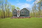 This 2, 900 square foot model features a spacious eat-in kitchen with an island, stainless steel appliances, pantry, and generous amounts of cabinet space. The kitchen leads to an elegant family room, which boasts high vaulted ceilings and a charming stone fireplace. The open concept and many windows in this home allow an abundance of natural light to spread across the hardwood flooring. Step out back to a lovely deck and private yard surrounded by greenery for the perfect serene retreat.
