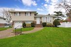 Beautiful, immaculate Split Level situated on quiet mid-block, features great curb appeal w/ brick & newer vinyl sided exterior, newer vinyl soffits, leaders & gutters, new sidewalk & driveway apron, brick paver walkway, driveway, new bluestone & brick stoop & steps, manicured landscaping. LR w/ Andersen bay window & built-in A/C, DR, EIK w/ oak cabinets, built-in microwave & ceiling fan. Upper level features Fbth w/ granite sink top & ceramic tile floor & shower, MBR w/ dual entry to Fbth, new built-in A/C, ceiling, & double mirrored closet. Second BR w/ hardwood floors & ceiling fan, third BR w/ wall to wall carpeting. Pull down attic w/ hideaway stairs. First floor features den w/ wall to wall carpeting, laundry room w/washer & slop sink, half bath. Basement finished, w/ family room w/ dry bar, plenty of closets & storage, Utility Rm w/dryer. Oil heat, 2-zone heat, new 275-gallon oil tank, 100-amp electric. All windows replaced, 1 car attached garage w/ vinyl garage door & electric garage door opener. Roof only 5 years old, stripped to sheathing. Breathtaking, huge, oversized park-like privately fenced backyard, over 1/4 acre, new PVC fencing in rear, covered patio, shed, IGS. Convenient to all transportation & shopping. Tax grievance filed.