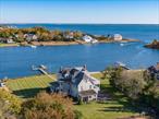A Waterfront Masterpiece in Center MorichesWhere Luxury, Privacy, and Coastal Elegance ConvergeIntroducing a truly once-in-a-lifetime opportunity to own one of Center Morichesâ€™ most coveted and iconic waterfront estates. Perfectly positioned South of the Highway and safeguarded by the tranquil waters of Senix Creek, this extraordinary 2-acre compound offers an unparalleled setting just moments from The Hamptons and the open expanse of Moriches Bay.From the moment you arrive, youâ€™re greeted by a breathtaking sense of scale, serenity, and sophistication. Boasting approximately 180 feet of pristine water frontage, the estate unfolds like a private coastal resort, where natureâ€™s beauty meets refined design. A charming boathouse invites you to explore the surrounding waterways, while the sparkling in-ground pool, framed by manicured lawns and mature landscaping, sets the stage for effortless outdoor living. With expansive grounds that offer ample space for a tennis court or additional amenities, the possibilities for creating your dream retreat are endless.At the heart of the property stands a magnificent Nantucket-style main residence encompassing over 6, 000 square feet of tastefully updated interiors. Featuring six spacious bedrooms and four beautifully appointed bathrooms, the home has been thoughtfully renovated to seamlessly blend timeless architectural charm with the modern conveniences of luxury living. Sunlight pours in through oversized windows, accentuating the soaring ceilings, airy open spaces, and bespoke designer finishes that grace every room. Sweeping sightlines and elegant textures evoke a sense of coastal ease, while state-of-the-art systems and high-end materials ensure comfort and functionality at every turn.Enhancing the estateâ€™s appeal is a picture-perfect carriage house, it sits alongside a stylish poolside bar, creating the ultimate backdrop for summer entertaining.With timeless updates throughout, a level of craftsmanship rarely found in todayâ€™s market, this unique estate is more than just a homeâ€”it is a legacy property, offering an elevated lifestyle defined by peace, prestige, and panoramic waterfront views.This is Center Moriches waterfront living at its absolute finest.