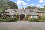 This stunning gated estate in Roslyn, NY sits on 2.55 acres of lush, private grounds within a secure compound. Fully gut-renovated in 2002, the home offers approximately 10, 000 square feet of luxurious living space, thoughtfully designed for comfort, relaxation, and entertaining.Inside, the home boasts 6 spacious bedrooms and 5.5 elegantly designed baths, soaring ceilings, radiant heat in the foyer and kitchen, and an elevator for easy access between the main levels. The primary suite is a luxurious retreat featuring a cozy fireplaceâ€”one of four in the home (three gas, one natural)â€”and a spa-like primary bath with a Jacuzzi, steam shower, and calming ambiance.Perfect for entertaining, the home includes a custom-built speakeasy that adds character and charm, along with a private movie theater offering the ultimate cinematic experience. The outdoor oasis features a resort-style pool with a grotto, cascading waterfalls, and a full-service pool house. Two BBQ areasâ€”one just off the kitchen and the other in the poolside cabanaâ€”make summer entertaining effortless. A newly redone fountain in the backyard, professional landscape lighting, and built-in speakers throughout the home and cabana create a truly elevated atmosphere.Additional features include a three-car garage, a full security system with burglar/fire/CO smoke alarms, two boilers with a backup system, a brand-new generator, central vacuum, and intercoms throughout. The pool equipment can be operated remotely (note: the heater will need replacement by the buyer). The recently rebuilt conservatory adds a brand-new addition to this already magnificent estate. Seamlessly blending timeless elegance with state-of-the-art conveniences, this estate is an unparalleled sanctuary in the heart of Roslyn., Additional information: Interior Features:Lr/Dr