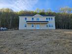 Let&rsquo;s welcome the Summer of 2025 with this beautiful and spacious contemporary home. It is nestled up on the hill with great views in the town of Wallkill. This gorgeous home is going to be ready in less than 6 to 8 weeks. The upper level is featuring an open layout with gleaming oak hardwood floors throughout a massive living room with a very high ceiling & built in electric fireplace to a formal dining area and a very wide and spacious gorgeous kitchen with a great size island, granite countertops & stainless appliances. There are two great size bedrooms, a hallway bathroom and a primary master bedroom with two closets and its own master bathroom. All the three bedrooms on the upper level are with hardwood floor and high ceiling. The lower level is where you find your main entrance with a great size foyer to a huge family room great for your entertainment, the 4th bedroom and a full stand up shower with a laundry room and 2 car garages. It&rsquo;s definitely a must see home and it is minutes to NYC Busses and train, major highways, hospital and medical centers and shopping.