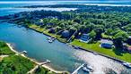 Experience coastal luxury in this meticulously renovated 6 bedroom, 3.5 bathroom residence spanning 3, 400 sq. ft. Nestled along the serene Wells Creek, this home boasts a private deep-water dock, offering direct access for boating enthusiasts.The interiors exude a sophisticated beach inspired ambiance, with light-filled spaces adorned in hues reflecting the surrounding waters. The open concept design seamlessly connects the gourmet kitchen, dining area, and living room, leading to an expansive deck, perfect for elegant entertaining or tranquil evenings watching breathtaking sunsets over Shinnecock Bay.Located moments from Ponquogue Ocean Beach, upscale shopping, a local movie theater, and renowned waterfront dining establishments, this property offers both seclusion and convenience.A rare opportunity to own a piece of Southamptonâ€™s finest waterfront real estate.