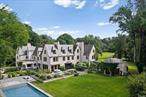 Nestled in the prestigious village of Matinecock, this exquisite 1926 French Normandy home, originally commissioned by J.D. Lyons and designed by renowned architects Delano and Aldrich, showcases a remarkable transformation by Oliver Cope, Architect, Miles Redd, Interior Designer, and Ed Hollander, Landscape Architect. This stunning manor perfectly marries historical elegance with modern luxury.Upon entering, you are welcomed by the warmth of fine craftsmanship, featuring intimate rooms thoughtfully designed for contemporary living. A standout octagonal room addition enhances the unique character of this exceptional residence. Traditional details such as antique parquet wood floors, 12 wood-burning fireplaces with original mantles, and exquisite handmade paneling coalesce beautifully with meticulous updates throughout.The chefâ€™s gourmet kitchen offers a dream space with Calcutta marble countertops and top-tier appliances, including Subzero refrigeration and a 6-burner Wolf range with ovensâ€”all complemented by a spacious island and dining area. For entertaining, a large formal dining room and a charming terrace invite serene outdoor summer meals, all overlooking the inviting pool.The tranquil outdoor space is a sanctuary, complete with a heated oversized gunite saltwater pool featuring a spa and electric cover, a separate pool house with shower and laundry facilities, and a beautifully landscaped lighted tennis court. Entertain with ease in the elaborate outdoor kitchen, which boasts a Grillworks grill, pizza oven, and premium Kalamozoo cabinetry. Lush gardens are adorned with rare climbing roses, hydrangeas, and espaliered fruit trees. A trellis draped in orange trumpet vine and climbing hydrangea creates the perfect setting for al-fresco dining, alongside numerous terraces and a golf green.Additional features include an elevator, a cutting-edge Nest security system, and a 3, 000-bottle temperature and humidity-controlled wine cellar. The spacious laundry room is equipped with two washers and two dryers, while the finished lower level, updated HVAC, and geothermal heating enhance comfort and efficiency. A separate garage completes this luxurious offering.This extraordinary home is truly a â€œmust see, â€ embodying unparalleled luxury and tranquility, located within the award-winning Locust Valley school district. Donâ€™t miss this rare opportunity to own a piece of Long Island history. Masterpiece Collection Listing