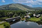 THREE BUILDINGS & BUSINESS/RENTALS INCLUDED! River Front Property. Inviting artists, collectors, and big thinkers to unlock their creative potential at this unique property nestled in the heart of Downsville. Prominently located along the pristine headwaters of the Delaware River, this serene property is comprised of three independent structures; a post and beam A-Frame lodge, a historic Victorian two family river front home, and a gigantic domed quonset hut with a rich history from an original movie theater to a well traveled antique store. The property&rsquo;s prime riverfront location grants direct access to the Delaware River, ideal for outdoor enthusiasts. Situated next to a landmarked covered bridge and a charming park, the property exudes small-town appeal and historical significance. Just 15 minutes from Roscoe, and two hours from Manhattan, this versatile property is perfectly suited for artists seeking a live-work space, collectors in need of ample display areas, or entrepreneurs with a unique vision. Don&rsquo;t miss this rare opportunity to own a piece of Downsville&rsquo;s history and create your own legacy in the heart of the Catskills. Seller is motivated and will consider all reasonable offers.