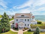 Live the waterfront dream and wake up every morning to stunning views of the Peconic Bay. Sparkling water and serene sunsets will be yours to behold. Entertain in the open main floor with easy access to the deck and a backdrop of sun glinting off the water. Outdoor views from the spacious deck off the second floor primary suite and the third floor office mean that whether relaxing, working or playing you can enjoy this view. Coffee in the morning to watch the sun come up. Cocktails and small plates on the deck out back and barbequing tableside. Lawn games by the water. Launch kayaks and paddle boards just steps from your deck. In other words, vacation daily in this location by the Bay. The house is a traditional style with cedar shake shingles, natural gas heat, wood floors, red oak decks, many windows and lots of sunlight. There are ceiling fans throughout the home encouraging true indoor/outdoor living. Go effortlessly from the living room to the back deck or continue on to the waterâ€™s edge. This kitchen features a gas range, wine fridge and quartzite counters over the work island and long counter with stools â€“ no doubt, where everyone will gather during meal preparation. The dining space adjacent to the kitchen is perfect for cooler weather celebrations. The gas fireplace adds warmth on a cool night.Family and friends will gather to enjoy all this home has to offer. With five bedrooms, you can accommodate overnight guests. Two bedrooms are on the main floor. Two additional bedrooms and the primary suite occupy the second floor. The home is big enough for everyone to find a favorite spot in it and perfectly sized to enjoy year-round or as your weekend getaway.This area of Historic Jamesport is in wine country, you wonâ€™t be far from dining, shopping and recreational opportunities. 77 Front Street is a true coastal gem offering the ultimate in both comfort and lifestyle.