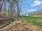 Wow! What a spectacular location! Set back off a quiet country road in Barryville NY and situated on a knoll, this home exudes curb appeal and elegance. Lovely expanded contemporary cape cod boasts a beautiful open floor plan with plenty of space for all to enjoy! Beautiful home welcomes you to a expansive rocking chair porch that you can enjoy for hours reading a book and sipping lemonade! For the chef in you the Custom kitchen has plenty of countertop and center island with stainless steel appliances and space galore! Beautiful wood floors throughout! Large living area is great for entertainment and the formal dining room has sliding doors to a back yard patio to relax and enjoy the sites and sounds of a sweet meandering stream. For convenience the primary bedroom suite is on the main level of the home with ensuite bathroom and walk in closet. Laundry room and main level powder room complete the downstairs. On the second level you&rsquo;ll find 2 large bedrooms with access to a full bath and a center office room. This amazing property is open and perfect for country living, plant a large garden, become a beekeeper, have some chickens or goats. Use the large barn on the property for all your outdoor storage or let your imagination soar to create a workshop, she shed, man cave or art studio. 2 lots of land included, totally nearly 5 acres with the possibility of building another home on the second property which currently has a separate driveway and older garage on it. Overall a really special property and a gorgeous home ready for it&rsquo;s new owners. Only 2 hours GWB and close to area amenities including Bethel Woods for Music Venues, Snow Skiing, the Delaware River for Recreation, hiking trails, farmers markets and so much more.