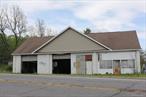 Unlock the potential of this 2, 340 sq. ft. building on 1.3 acresâ€”perfectly positioned for maximum visibility on a busy thoroughfare with an impressive 2, 000+ vehicles passing daily!Whether you&rsquo;re dreaming of opening a deli, donut shop, auto repair center, convenience store, or retail business, this property is primed for success. Featuring two large overhead garage doors and plenty of parking space, the possibilities are endless.* Zoned for commercial use.* Two large overhead garage doorsâ€”perfect for auto-related businesses or storage.* Spacious lotâ€”ample room for parking or outdoor use.* High-traffic areaâ€”maximize your business visibility and customer reach.Donâ€™t miss this rare chance to establish your business in a thriving, high-visibility area. Schedule a showing and explore how this property can power your next venture!