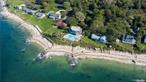 Spectacular, contemporary seasonal rental home with pool and Jacuzzi on the Long Island Sound front. 150 feet of direct waterfront and beach, with incredible view. Meticulously renovated and professionally designed. 6 bedrooms, 5.5 bathrooms. Hamptons luxury in North Fork. Home situated on 1 acre, 6, 600 square feet. One master bedroom has jacuzzi and steam room and two extra bedrooms with full bathroom on first floor. Second floor has living room, dining room, eat-in kitchen, half bathroom, and one full bathroom. Balcony has amazing view. Basement has two bedrooms, one bathroom and living area, dining area and kitchen. Wi-fi, Outdoor sound system, newish furnished, ground pool, and outdoor shower room. All with direct water access, the best in coastal living.