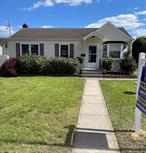 Charming 3-bedroom, 1-bath Ranch in West Babylon featuring a full attic, eat-in kitchen, and spacious yard. Completely redone hardwood floors throughout. Central air conditioner is a year old with 10-year transferable warranty, hot water heater is 5 years old, roof is 7 years old. Gas available in the area. Great location near schools and amenities, beautifully completely redone bathroom, full basement with outside entrance. Move in ready.