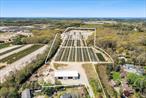 A truly extraordinary offeringâ€”32+ prime acres of versatile land with valuable development rights intact (DRI), allowing for expansion, transformation, or long-term investment. This unique parcel presents limitless potential, from agricultural innovation to private development. With 31.45 acres zoned R-80, and 0.68 acres zoned Hamlet Mixed Use, a variety of income-producing or community-driven purposes are possible. At the heart of the property stands a 6, 334 sq ft Morton building, engineered for durability and flexibility. Ideal for large-scale storage, a working facility, or future conversion into a more specialized use, this structure supports a wide range of possibilities. Complementing the offering are 324, 000 square feet of cold-frame hoop greenhousesâ€”an incredible asset for commercial growing operations, sustainable agriculture, a potential horse farm, or adaptive reuse into a multitude of functions.This is not just acreageâ€”it is a future-ready investment in land, infrastructure, and vision. Ideal for creating a private retreat, designing a multi-home compound, or leveraging the existing agricultural footprint for immediate productivity. Location, scale, and opportunity align in this exceptional parcel. One of the largest and most development-ready properties currently available. Private tours are available upon request. Explore the full potential of this one-of-a-kind offering.