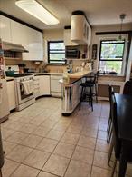 Beautiful 2 Bedroom, 1.5 baths CORNER UNIT. Living room, dining room, kitchen w/ dishwasher, washer/dryer. Southern exposure. Steps to shopping, public transportation , houses of worship. INVESTOR FRIENDLY CO-OP. A MUST SEE !!!!!!!
