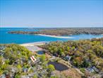 Welcome to this stunning High-Ranch summer/weekend vacation home in Huntington Bay, overlooking the exclusive 1-acre Pond-View with access to the Knollwood Beach community.This gem offers 5 bedrooms, 3 full baths, and 2 fireplaces, along with a private backyard featuring a deck and paver patio. Updates include a modern kitchen and bathrooms, in-ground sprinklers, paver patio, and 200-amp electric service â€” plus so much more!Enjoy abundant natural daylight throughout all 5 bedrooms and living areas, thanks to the homeâ€™s desirable southern exposure.As a resident, youâ€™ll have deeded beach and mooring rights at Knollwood Beach, complete with a kayak slip, lifeguards, and private community events.Schedule your private tour today!