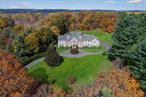 Grand Greenwich Estate  Luxurious Living on 4.3 Acres Nestled at the end of a quiet cul-de-sac, 27 Stiles Lane is a magnificent brick manor set on 4.3 private acres of lush, manicured grounds. Offering 7, 438 square feet of refined living space, this exceptional estate is designed for those who appreciate elegance, comfort, and unparalleled amenities. Inside, the grandeur unfolds with six ensuite bedrooms, ensuring ultimate privacy and convenience. The heart of the home features two fireplaces, creating warm and inviting spaces for relaxation. A gorgeous library with custom millwork is a sanctuary for book lovers or an ideal work-from-home retreat. Step outside to discover your resort-style backyard, where an oversized pool, tennis court, and sprawling stone patio set the stage for effortless entertaining. Gather around the fire pit under the stars or enjoy peaceful moments in this secluded oasis. A bonus room offers endless possibilities-fitness studio, media lounge, or playroom-while a three-car garage provides ample storage. This is more than a home-it&rsquo;s a private Greenwich retreat where every detail is designed for luxury living.