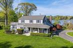 Serene Lake Front Estate in Mattituck Situated on over an acre of tranquil waterfront, this peaceful and private estate offers stunning views of Maratooka Lake and a lifestyle of luxury and relaxation. Located just minutes from the heart of Mattituck and New Suffolk Beach, this 3000+ sq ft home is a rare North Fork gem. The residence features 5 bedrooms, including a luxurious primary suite with water views, generous closets, and a beautifully appointed bath. The recently renovated kitchen boasts quartz countertops, high-end appliances, and a thoughtful design perfect for chefs and entertainers alike. A bright and airy great room with a gas fireplace opens to a waterfront deck and is outfitted with a wet bar and wine fridgeâ€”ideal for gatherings. The large dining room includes a cozy wood-burning fireplace, creating a warm, inviting atmosphere year-round. Step outside to your entertainerâ€™s paradise: Enjoy swimming in a brand-new heated saltwater pool or relaxing in your new spa surrounded by a mahogany deck with sleek glass railings that maximize the lake views. Enjoy kayaking on the calm waters of Maratooka Lake or take in the incredible birdwatching opportunities from your backyard. Additional features include a detached two-car garage, a full basement, a new heating and air system, French drain system, new Sonos system for indoor and outdoor entertaining and a whole-house generator.