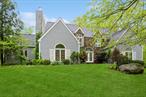 Elegantly updated Modern Colonial with majestic curb appeal on a quiet country cul-de-sac. Ten minutes to Wilton/New Canaan (Connecticut) train stations. Picture perfect corner lot in gorgeous Northern Westchester, A grand foyer with double height ceilings ushers you into generously sized rooms with three cozy wood burning fireplaces. Eight French doors from three welcoming rooms open out onto a enclosed three season wraparound rear deck nestled within serene woodlands. Enjoy family and entertain amid tree top views and the sounds of a flowing brook. The main floor includes a private guest suite/ office space with its own fireplace, full bath and wardrobe. The inviting eat-in kitchen with new build-in bar and pantry opens onto a large airy family room with high ceilings and a rustic fireplace. Double French doors open onto an eight-person jacuzzi on the main upper deck which leads to an over-sized adjacent covered wraparound deck. Fantastic for entertaining indoors and out. Second floor with a catwalk hallway leading to the magnificent main bedroom suite with soaring ceilings, wall-to-wall wardrobes and a stunning marble bathroom with spa-jet bathtub and waterfall shower. Large walk-in closet and additional storage in the attic above. Two additional high-ceilinged spacious bedrooms and an adjoining newly styled Jack-and -Jill bathroom. An additional 700 sf of living space in the newly finished lower level. Game room, exercise room, man cave or guest suit with double French doors which open to a spacious separate room with full bath. Bucolic front yard with mature flowering trees, new sprinkler and drip systems and two car garage. Additional storage space in basement and shed.