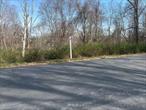 Opportunity to build on 3+ acres on a quiet country road in an established Pound Ridge neighborhood. The property abuts the 35 acre Thalheim Preserve, is lightly wooded and slopes toward the back of the property which is bordered by a small stream. The location offers quick and easy access to schools, shops, town park and library. Property includes a NYSEG easement.